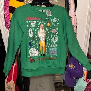Green girls Elf Christmas Graphic Sweatshirt it sings songs